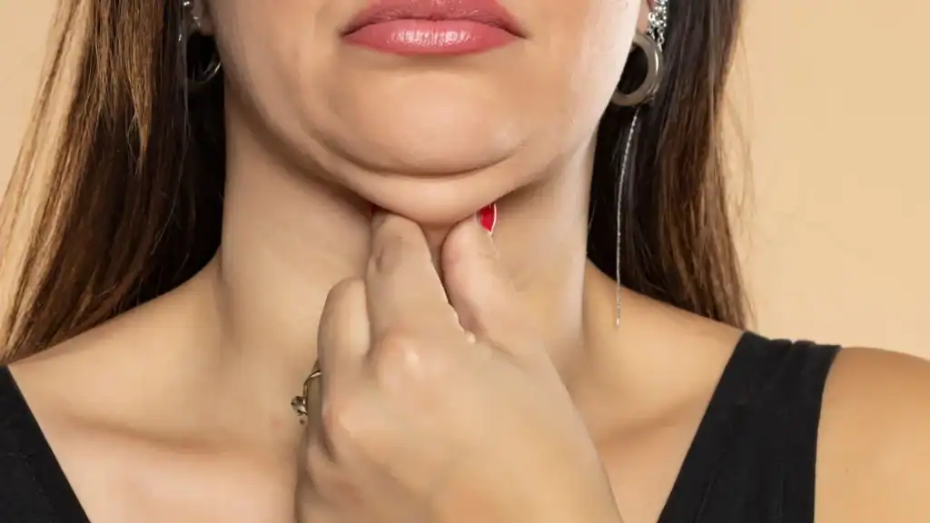 An image of a woman with double chin, sad, worried : Non Surgical Double Chin Removal Treatment in Streatley, UK